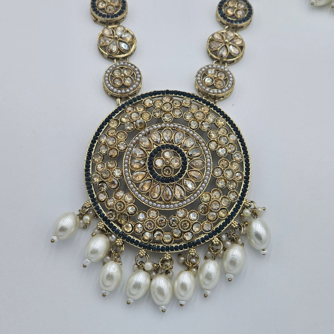 BelleNoor antique gold Kundan pendant necklace featuring a large circular design with pearl drops and intricate stones
