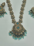 BelleNoor aqua blue kundan necklace set with antique gold finish, floral pendant, and matching jhumka earrings.
