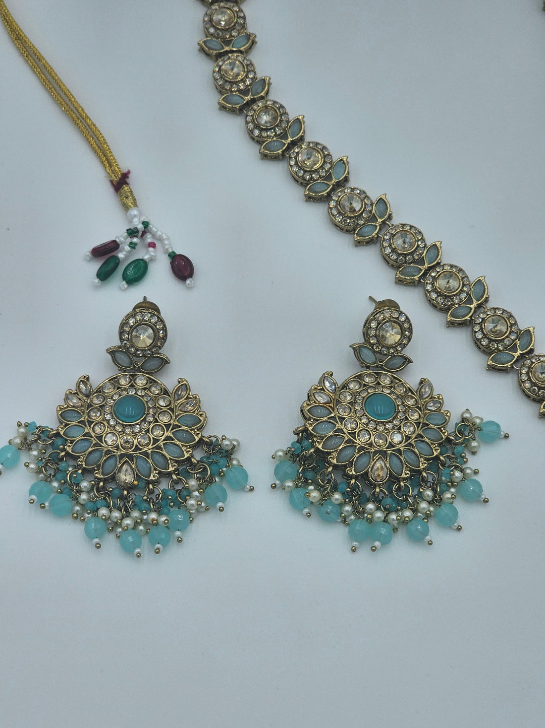 BelleNoor aqua blue Kundan necklace set with antique gold finish, crystal rhinestones, and faux pearl bead tassels.