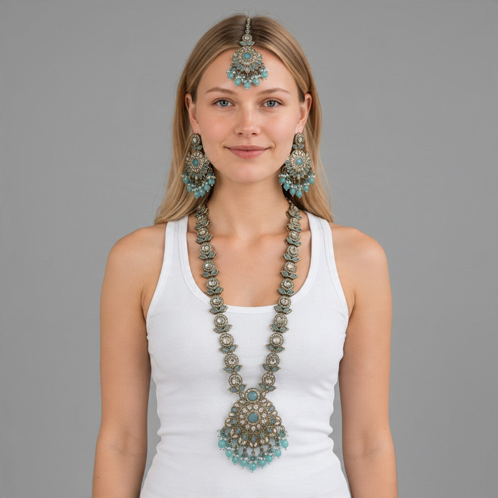 BelleNoor aqua blue Kundan necklace set with matching earrings and maang tikka, featuring antique gold finish.