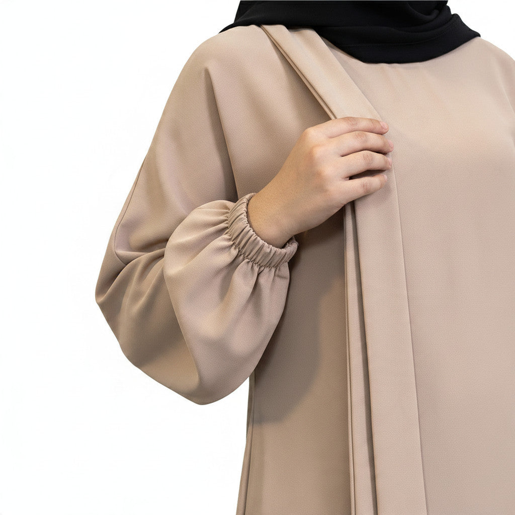 BelleNoor beige abaya featuring elegant balloon sleeves with elasticated cuffs and a flowing modest silhouette