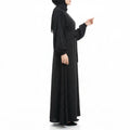 BelleNoor black Nida abaya featuring a tie-waist, long sleeves with cuffs, and an elegant flowing drape