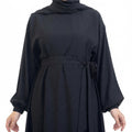 BelleNoor black Nida abaya with a belted waist and elegant draped sleeves, perfect for everyday sophisticated wear.
