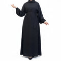 BelleNoor black Nida abaya with long puff sleeves and a matching waist tie, featuring an elegant, flowing drape.