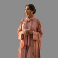 BelleNoor dusty pink floral print open abaya set with matching hijab worn by a woman holding a ceramic mug