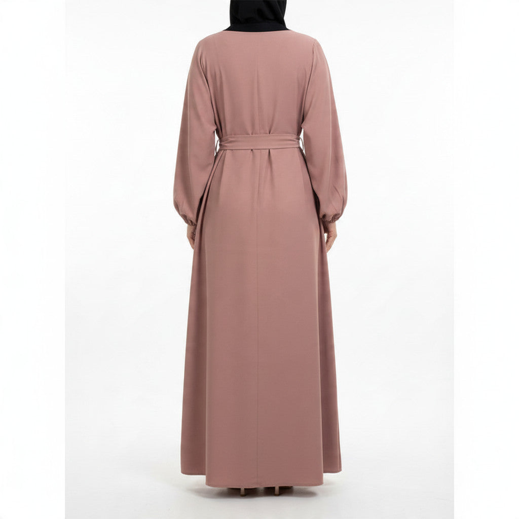 Back view of a BelleNoor dusty rose maxi abaya with long sleeves, elastic cuffs, and a matching waist tie.