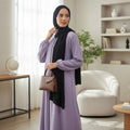 BelleNoor lavender abaya with front zipper and elastic cuffs, styled with a black chiffon hijab and brown handbag