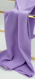 BelleNoor light purple crepe chiffon hijab with a subtle textured finish draped elegantly over a gold stand