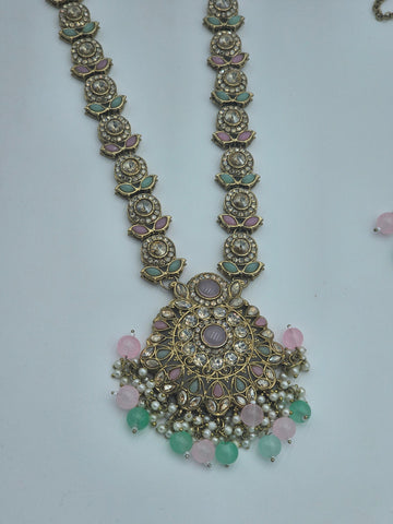 BelleNoor long Kundan necklace with pink and mint Meenakari leaf motifs, pearl clusters, and ornate medallion pendant.