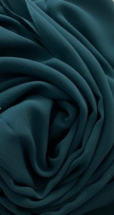 BelleNoor pine green crepe chiffon hijab with a soft textured drape and lightweight fabric finish.