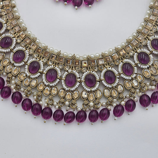 BelleNoor royal purple Kundan necklace with gold accents, white stones, and hanging purple beads for bridal wear.
