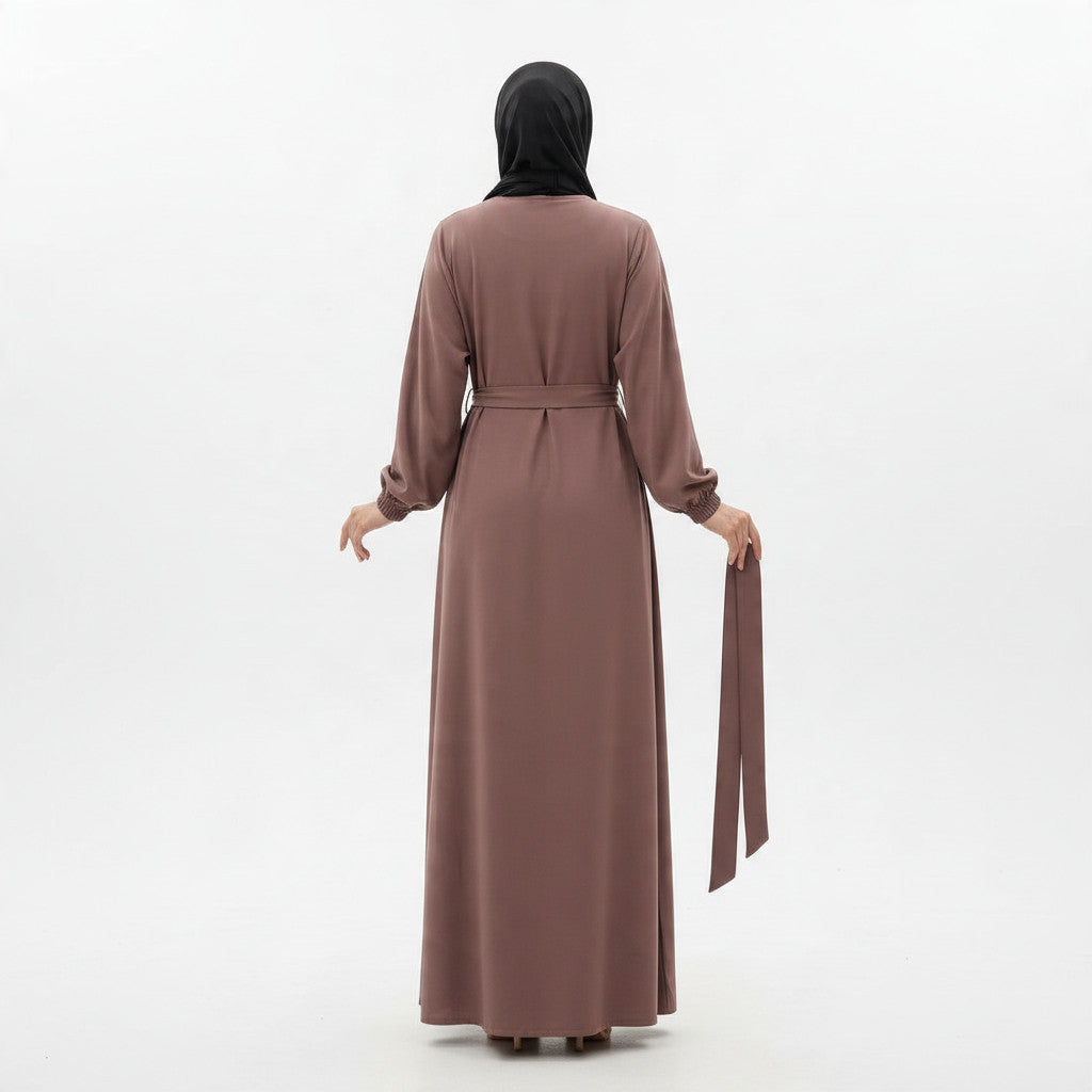 Back view of a BelleNoor purple Nida fabric abaya with a belted waist and cuffed sleeves worn with a black hijab