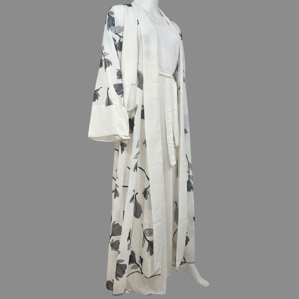 BelleNoor white abaya featuring a black and grey floral branch print, open front, wide sleeves, and matching hijab.