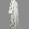 BelleNoor white abaya featuring a black and grey floral branch print, open front, wide sleeves, and matching hijab.