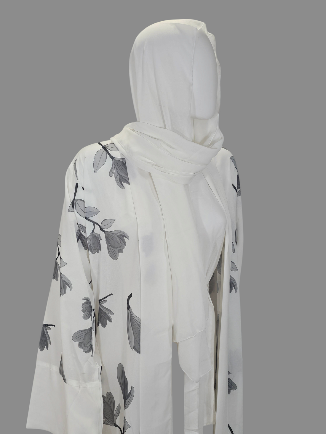 BelleNoor white abaya with black and grey floral branch print, open front, wide sleeves, and matching hijab on mannequin
