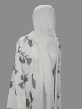 BelleNoor white abaya with black and grey floral branch print, open front, wide sleeves, and matching hijab on mannequin