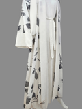 BelleNoor white abaya featuring a black and grey floral branch print, open front, waist tie, and matching hijab.