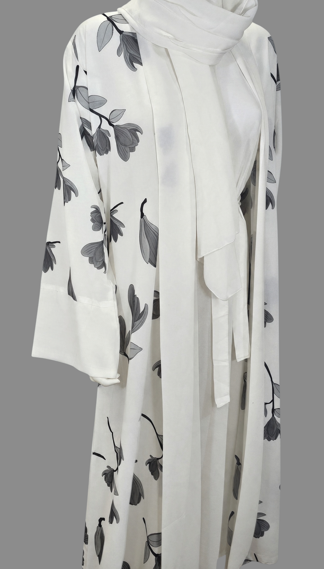 BelleNoor white abaya with black and grey floral branch print, wide sleeves, waist tie, and matching hijab.